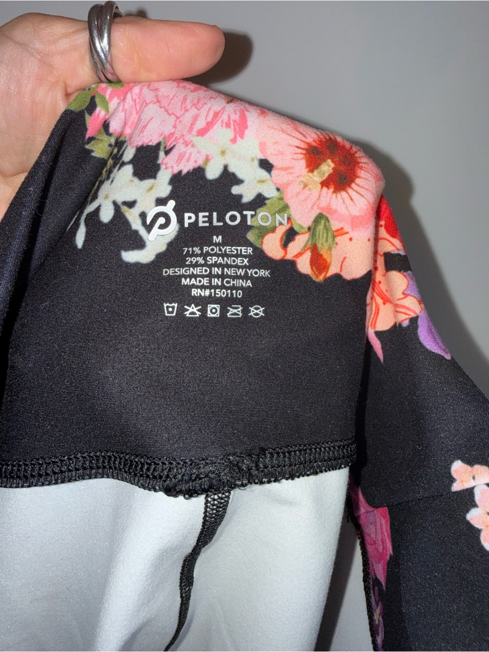 Peloton Black Leggings and Floral Sports Bra Set with Pink Accents - Picture 4 of 5